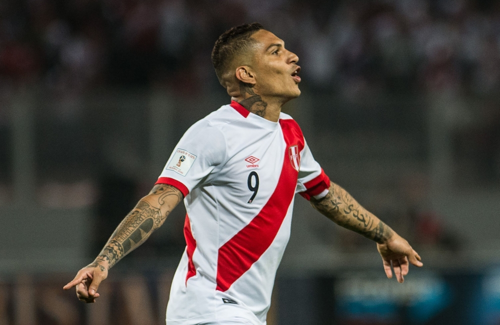 This file photo shows Peru's Paolo Guerrero celebrating after scoring against Colombia during their 2018 World Cup qualifier football match in Lima. Peruvian captain Paolo Guerrero will miss the World Cup after been banned from football for a year for failing a drugs test, FIFA's disciplinary committee announced on Friday. — AFP