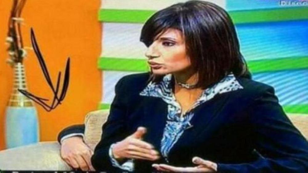 The anchor was seated on her chair, too involved in her interview, when one of her co-workers’ hand appeared to be fixing something at the back of her seat.