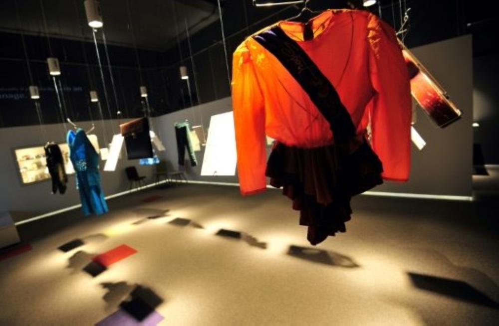 Children's clothes are displayed at The War Childhood Museum in Sarajevo, Bosnia. - AFP