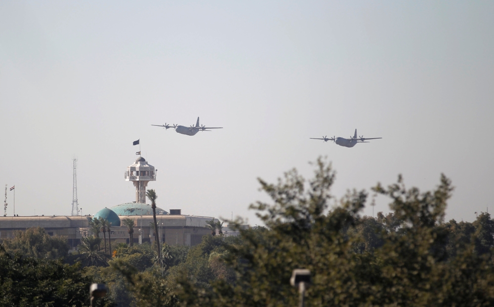Military planes fly during an Iraqi military parade in Baghdad on Sunday. — Reuters