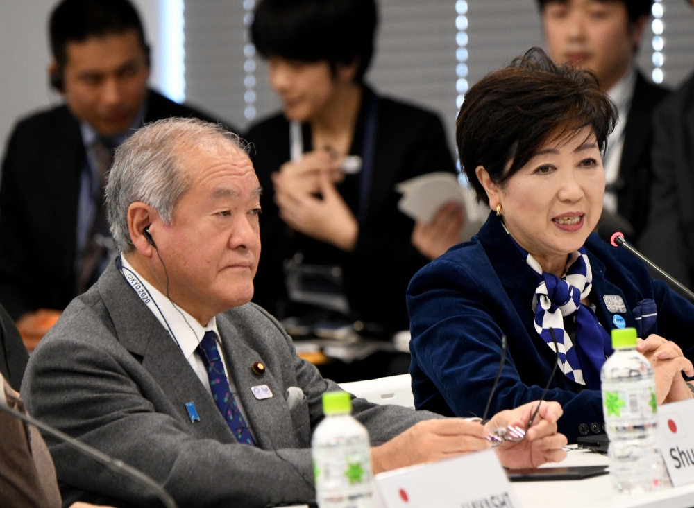 Tokyo Governor Yuriko Koike (R) delivers a speech beside State Minister in charge of Tokyo Olympics Shunichi Suzuki (L) during the fifth meeting of the International Olympic Committee (IOC) Coordination Commission for the Olympic Games Tokyo 2020 in Tokyo on Monday.  — AFP 
