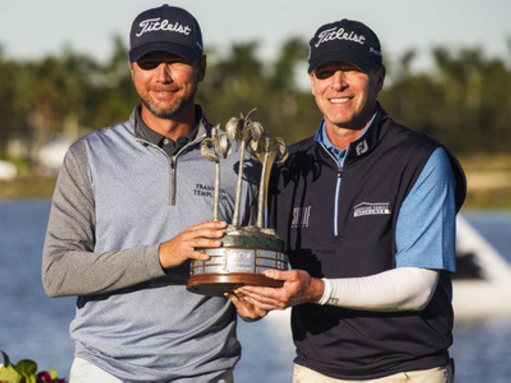 Sean O'Hair, left, and Steve Stricker hold up their trophy after winning the final round of the QBE Shootout golf tournament at Tiburón Gulf Club in Naples, Fla., Sunday. — AP