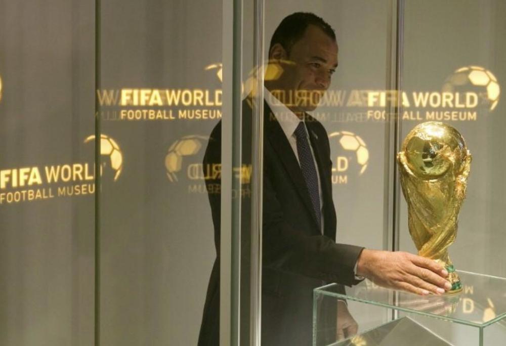 Brazil's former soccer player Cafu places the FIFA World Cup trophy into a glass cabinet during a media preview at the new FIFA World Football Museum in Zurich, Switzerland, in this file photo. — Reuters