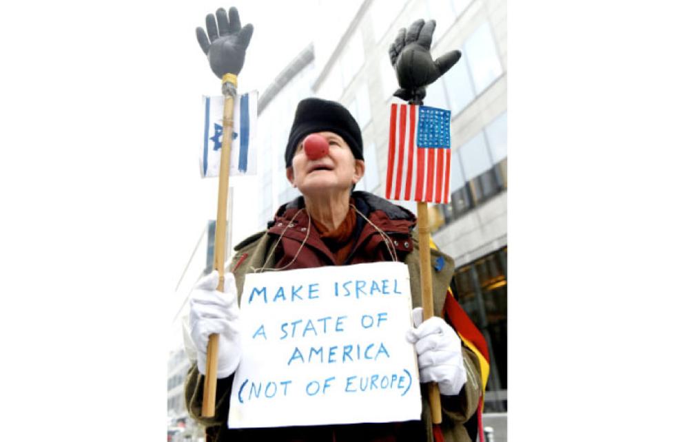 
A person dressed as a clown protests in Brussels, Belgium, on Monday against US President Donald Trump’s recognition of Jerusalem as Israel’s capital. — Reuters