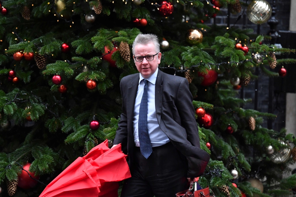 Britain’s Environment Secretary Michael Gove leaves 10 Downing Street after the weekly meeting of the cabinet in central London on Monday. — AFP