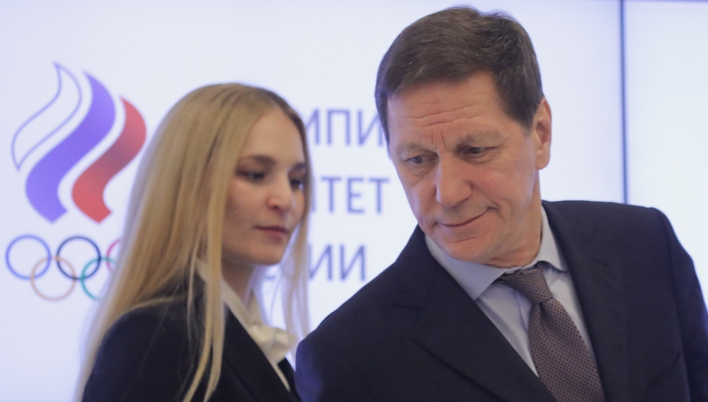 Russian Olympic Committee (ROC) President Alexander Zhukov and Sofya Velikaya, Chairman of the committee's Athletes' Commission, arrive for a news conference following a meeting on the country's participation at the 2018 Pyeongchang Winter Olympics, in Moscow, Russia, on Tuesday. — Reuters
