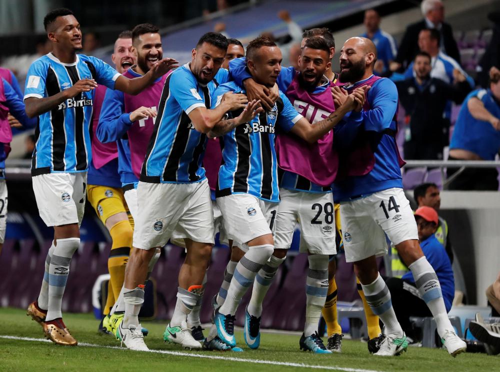 Gremio’s Everton celebrates with teammates after scoring their only goal against Pachuca in the semifinal match of the FIFA Club World Cup at the Hazza Bin Zayed Stadium in Al Ain Tuesday. — Reuters