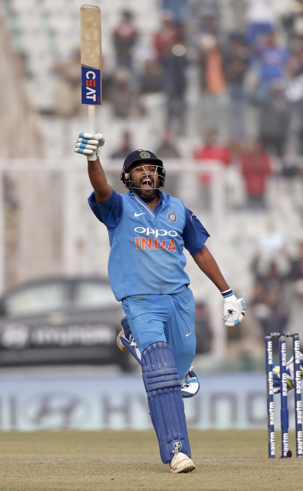 India's captain Rohit Sharma celebrates scoring a double century during their second One-Day International cricket match against Sri Lanka in Mohali, India, Wednesday. — AP