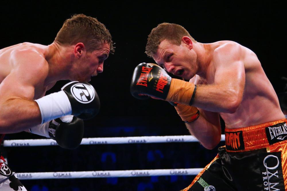 Australian boxer Jeff Horn (R) and English boxer Gary Corcoran (L) fight during their World Boxing Organization welterweight title bout at Brisbane Convention Centre in Brisbane Wednesday. — AFP