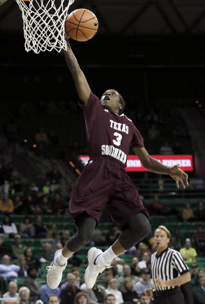 Texas Southern guard Demontrae Jefferson leaps to the basket during their NCAA college basketball game against Baylor in Waco, Texas, Thursday. — AP 