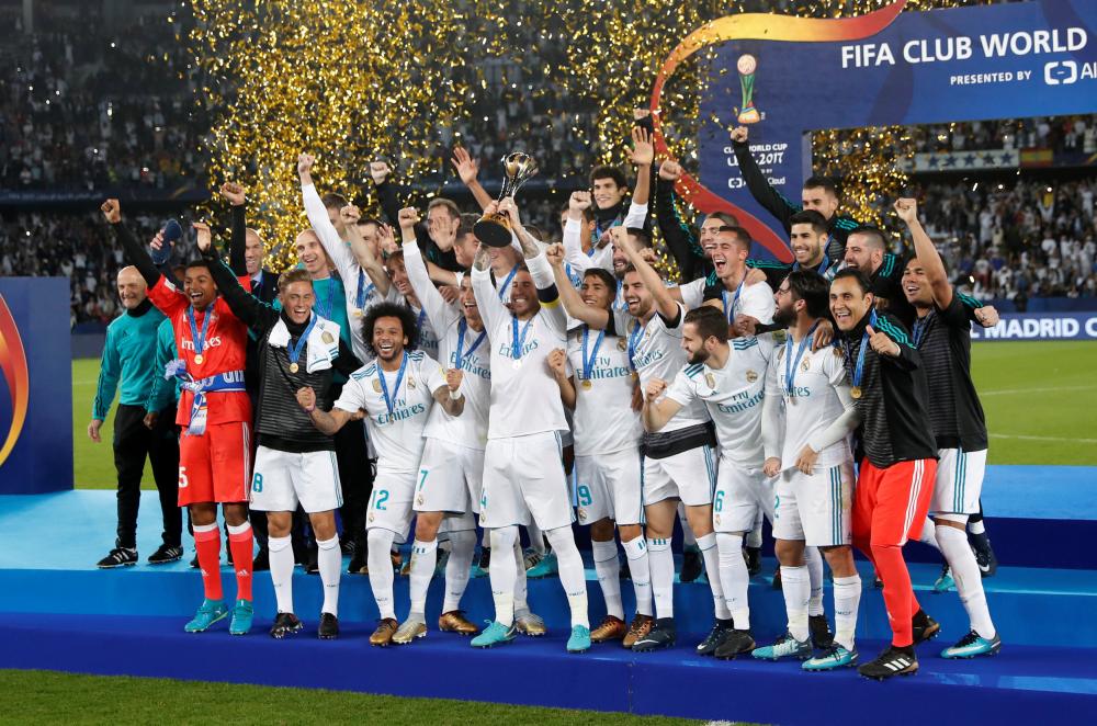 Real Madrid players celebrate with the FIFA Club World Cup after beating Gremio in the final at the Zayed Sports City Stadium, Abu Dhabi, Saturday. — Reuters