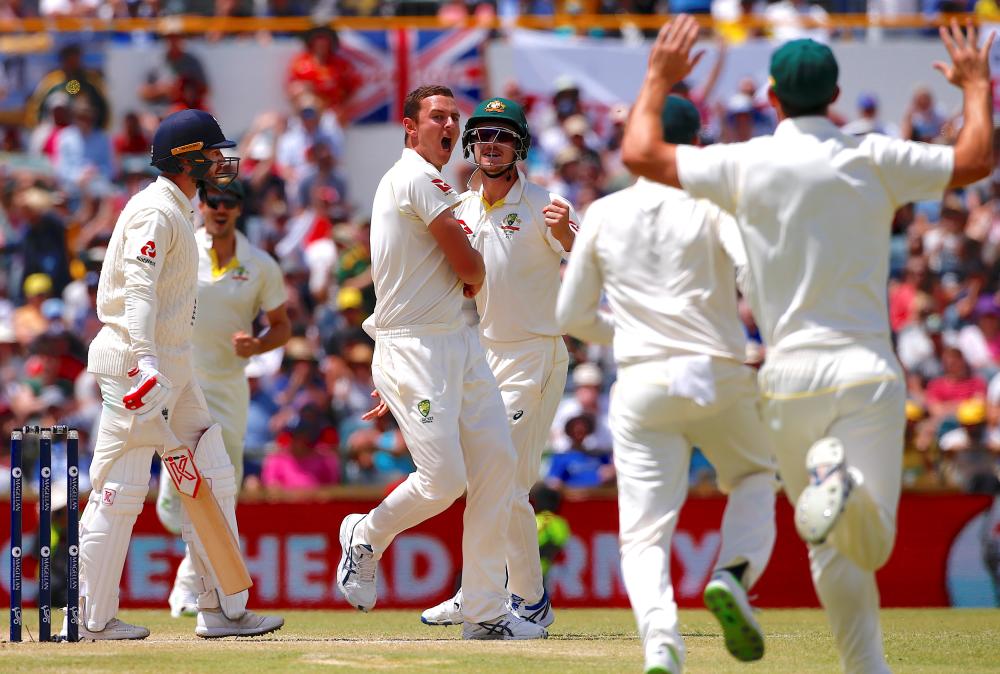 Australia’s Josh Hazlewood celebrates with teammates after dismissing England’s Mark Stoneman during the fourth day of the third Ashes cricket Test match at WACA Ground in Perth Saturday. — Reuters