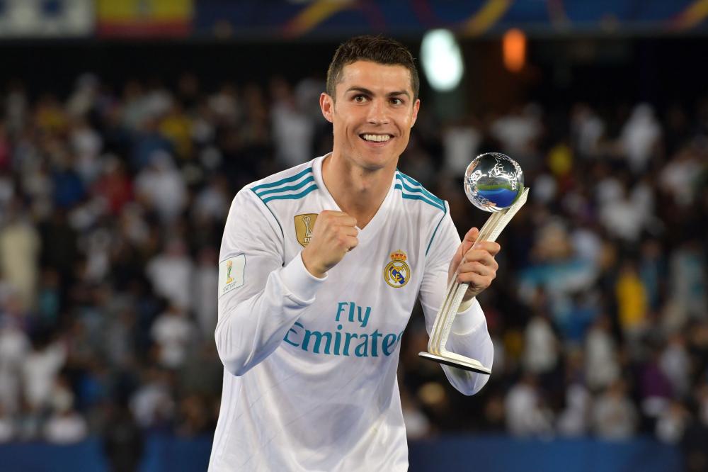 
Real Madrid forward Ronaldo celebrates with the 2017 FIFA Club World Cup Silver Ball award following their victory in the Club World Cup final against Gremio at Zayed Sports City Stadium in Abu Dhabi Saturday. — AFP