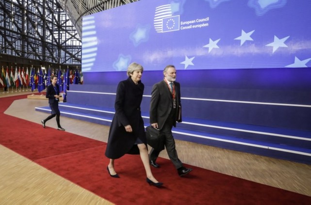 Britain's Prime minister Theresa May (L) and UK Permanent Representative to the EU Tim Barrow arrive to attend the first day of a European union summit in Brussels on Dec. 14. — AFP