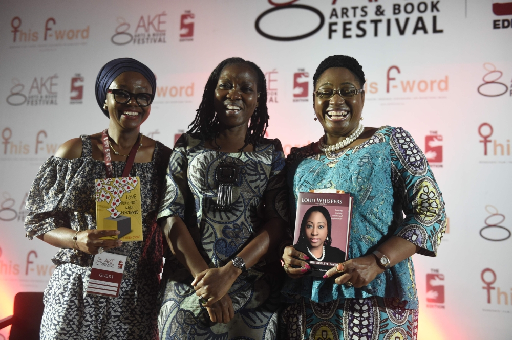 This file photo taken on Nov. 17, 2017 in Abeokuta, southwest Nigeria, shows Moderator Molara Wood, center, flanked by authors Ayisha Osori, left, and Bisi Adeleye-Fayemi, posing with their books after a discourse on 