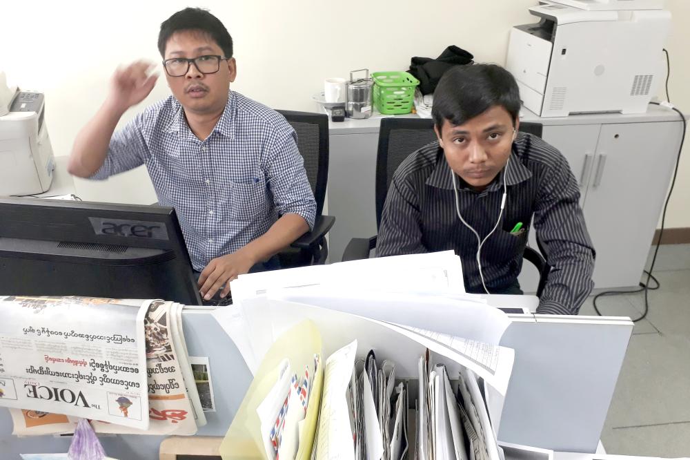 Reuters journalists Wa Lone, left, and Kyaw Soe Oo, who are based in Myanmar, pose for a picture at the Reuters office in Yangon, Myanmar, in this Dec. 11, 2017 file photo. — Reuters