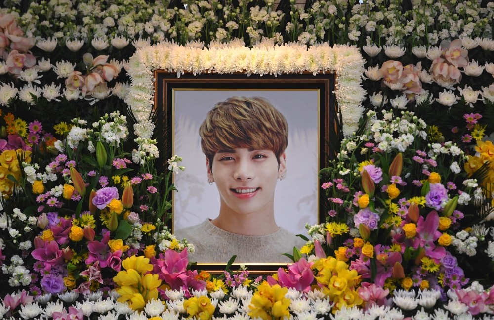 A portrait of Kim Jong-Hyun, the 27-year-old lead singer of the massively popular K-pop boyband SHINee, is seen on a mourning altar at a hospital in Seoul on Tuesday. - AFP