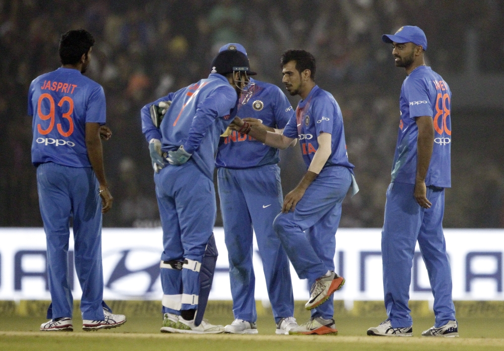 India's Yuzvendra Chahal, second right, celebrates with teammates the dismissal of Sri Lanka's Angelo Mathews during their first Twenty20 international cricket match in Cuttack, India, Wednesday. — AP