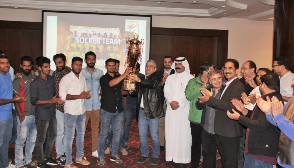 Players of United Football Club with USG Boral Management holding the winner’s trophy.