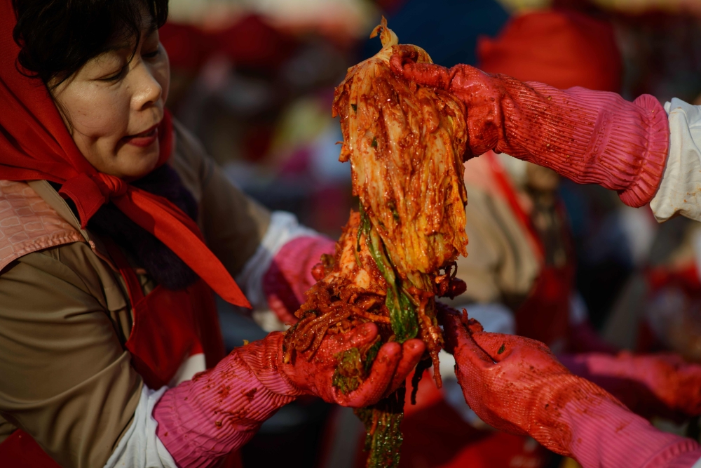 Kimchi is being prepared during a kimchi-making event in Seoul in this Nov. 14, 2014 file photo. — AFP