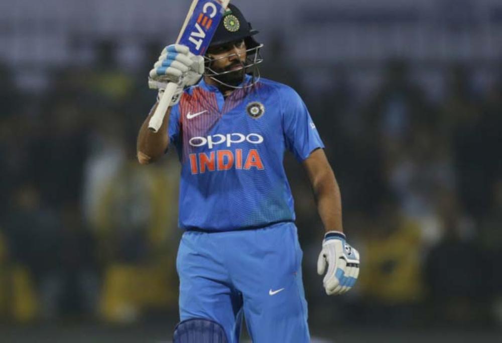 India's captain Rohit Sharma celebrates his record ton during their second Twenty20 International cricket match against Sri Lanka in Indore, India, Friday. — AP 