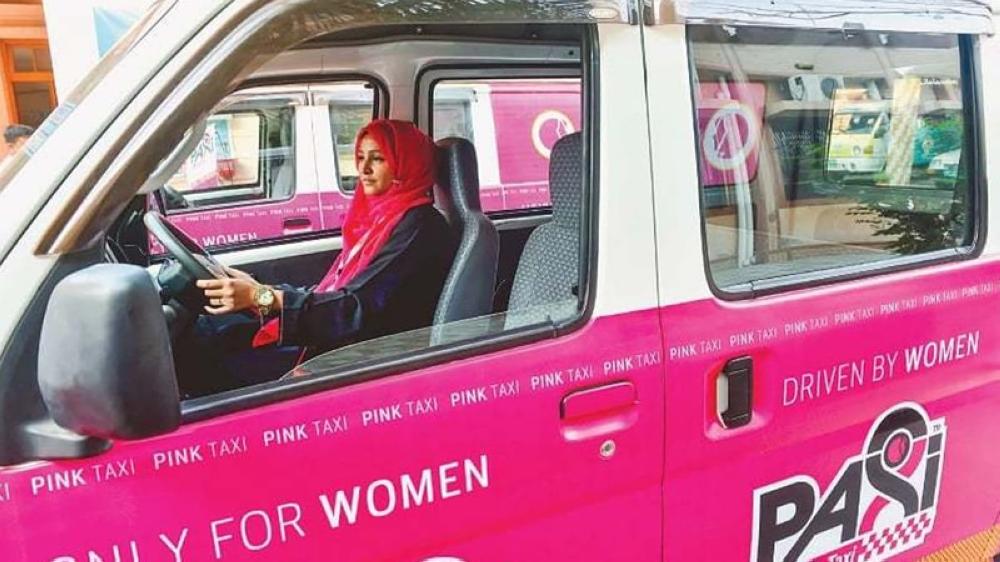 A Pakistani woman is seen driving a Paxi in Karachi, Pakistan. From sitting in 
