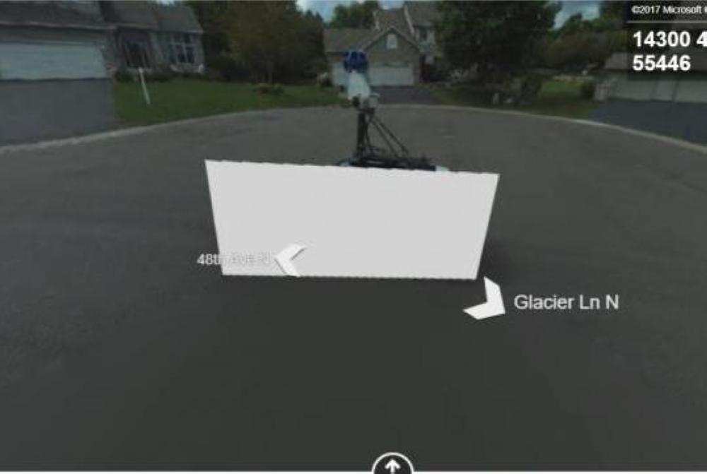Google and Bing's camera cars passed each other on a Minnesota road and the image that ended up on Bing's Streetside map feature ended up censoring the Google car with a white block.
