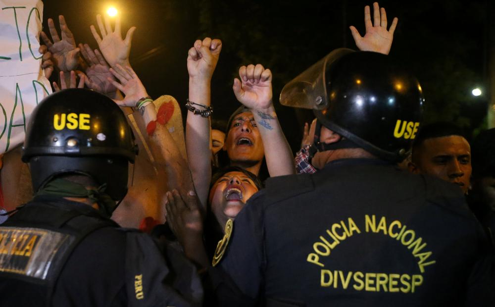 Protesters march near Centerio hospital after Peruvian President Pedro Pablo Kuczynski pardoned former President Alberto Fujimori in Lima, Peru, on Monday. — Reuters
