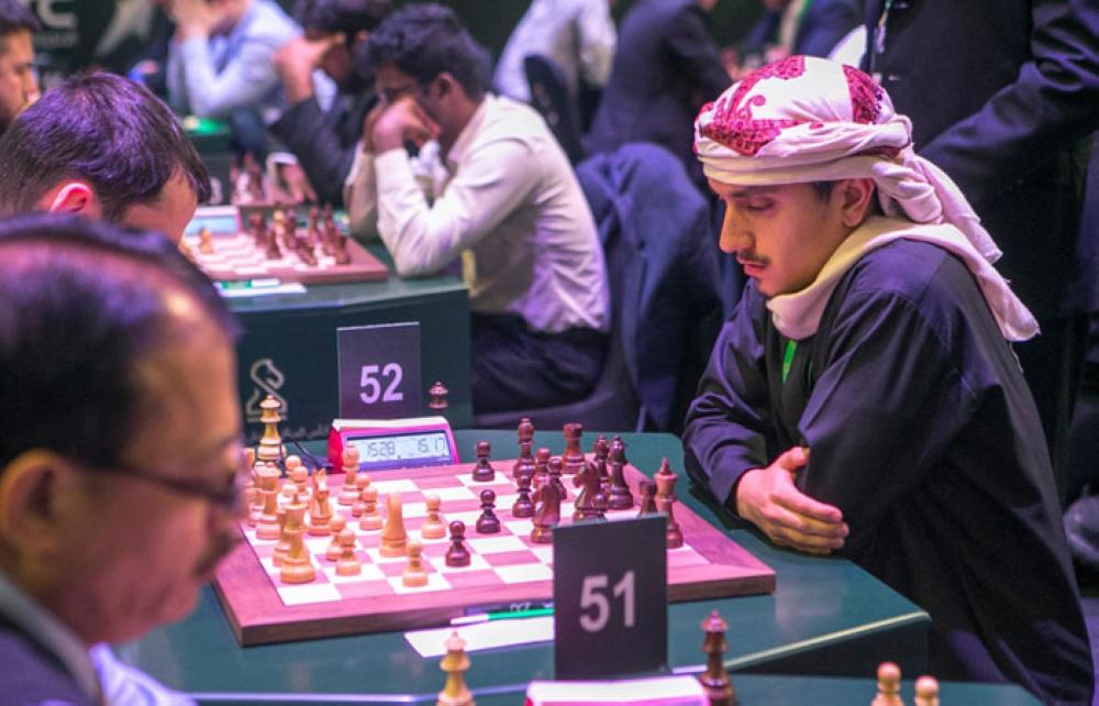 Norwegian chess player Magnus Carlsen (R) attends the King Salman World Rapid and Blitz Championships, the first international chess competition held in Saudi Arabia. — AFP