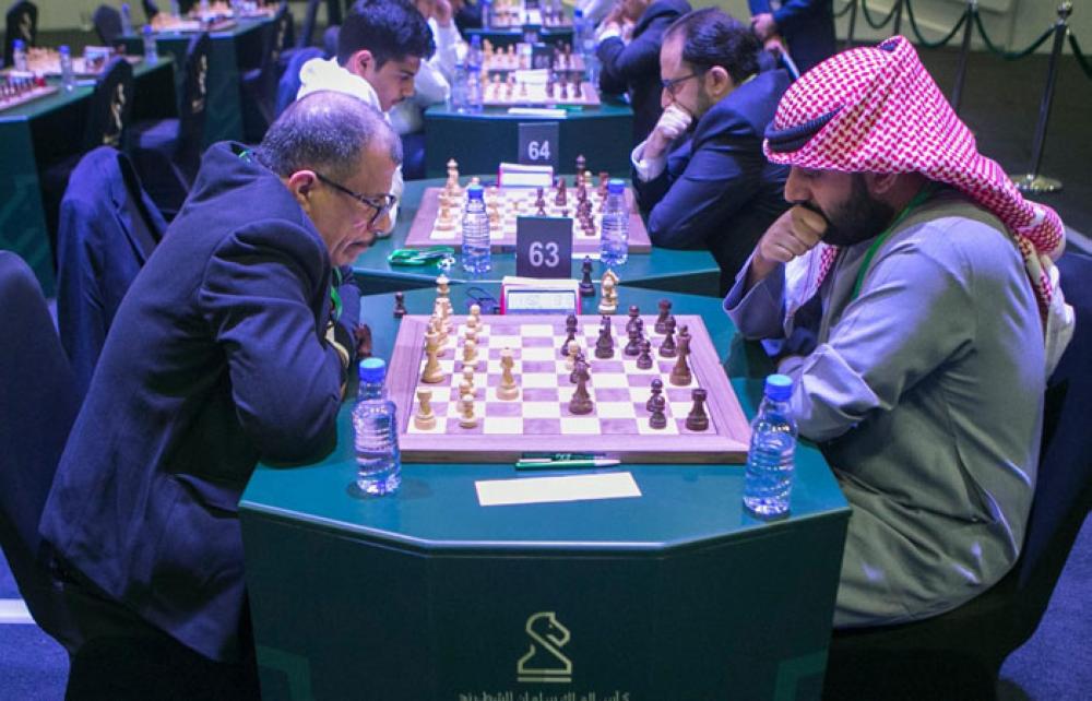Norwegian chess player Magnus Carlsen (R) attends the King Salman World Rapid and Blitz Championships, the first international chess competition held in Saudi Arabia. — AFP