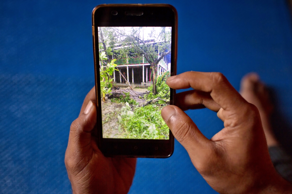 Mujibullah, 22, a Rohingya refugee watches a video, which he has shot in Myanmar before crossing over into Bangladesh, at Kutupalong refugee camp in Ukhiya, Bangladesh, in this Dec. 23, 2017 file photo photo. — AP