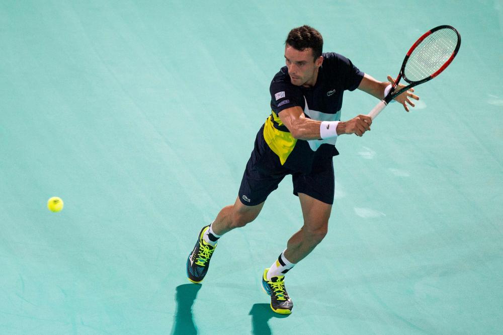 Spain's Roberto Bautista Agut returns the ball to Russia's Andrey Rublev during their Mubadala World Tennis Championship 2017 match in Abu Dhabi Thursday. — AFP