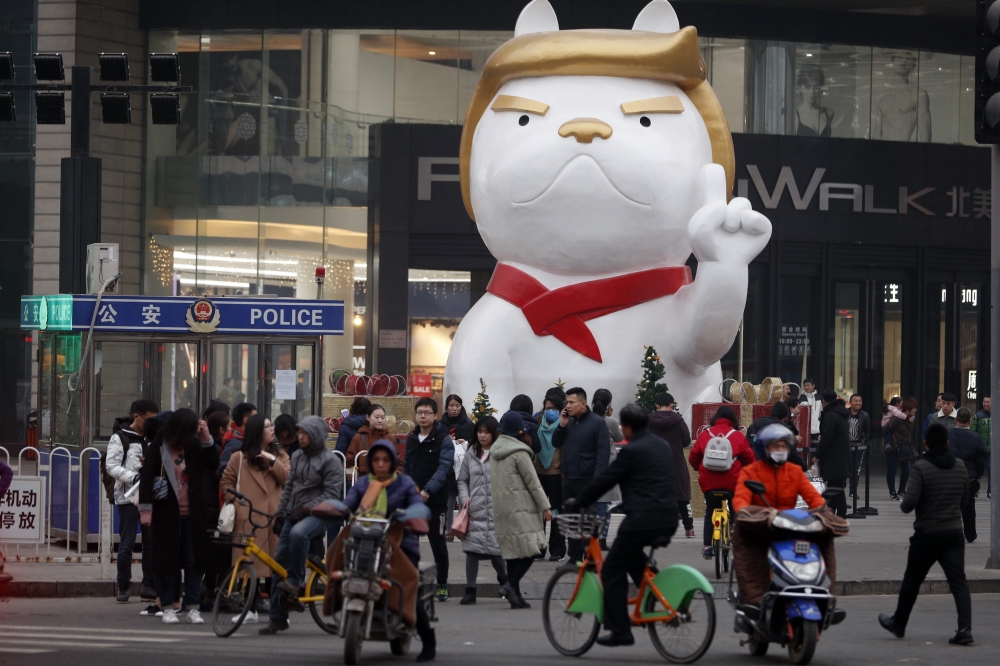 A 22-foot dog sculpture with features widely perceived in China to resemble US President Donald Trump is seen erected outside a shopping mall to celebrate the upcoming 