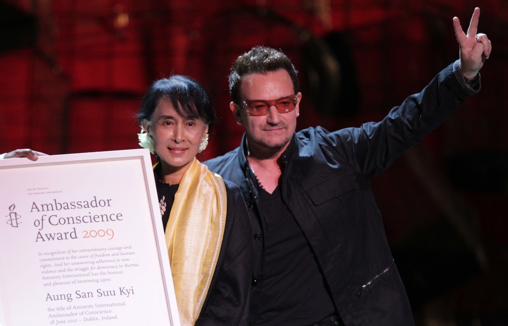 This file photo taken on June 18, 2012 shows Myanmar democracy icon Aung San Suu Kyi accepting the Ambassador of Conscience Award next to Irish singer Bono at the Bord Gais Energy theatre in Dublin, Ireland. - AFP
