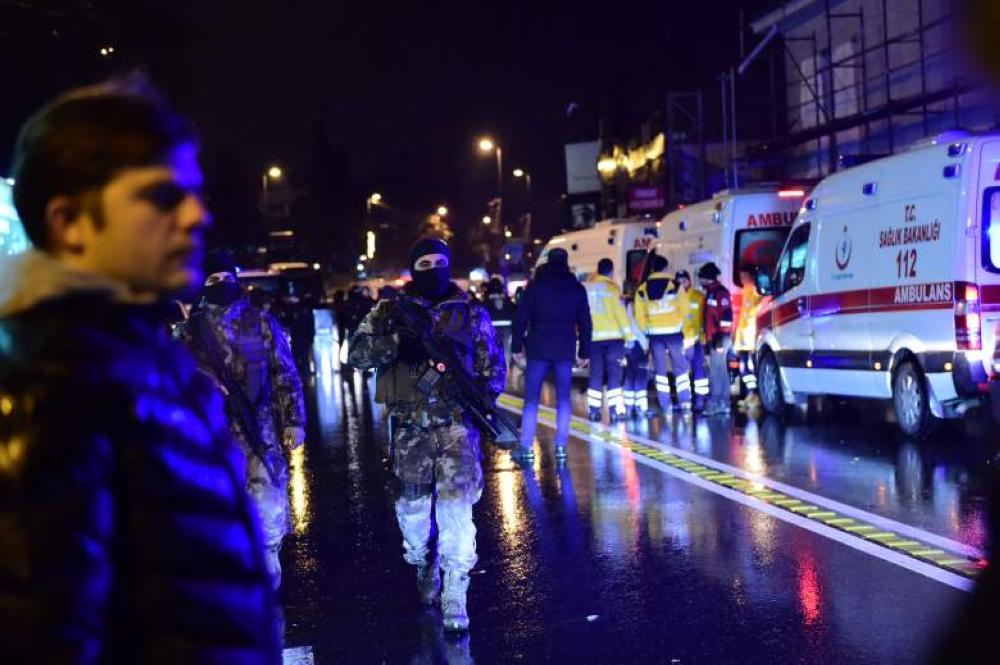Paramedics and police gather outside Reina club in Istanbul after an Uzbek gunman ran amok with a Kalashnikov killing indiscriminately and later slipping away in a taxi in January. — File photo