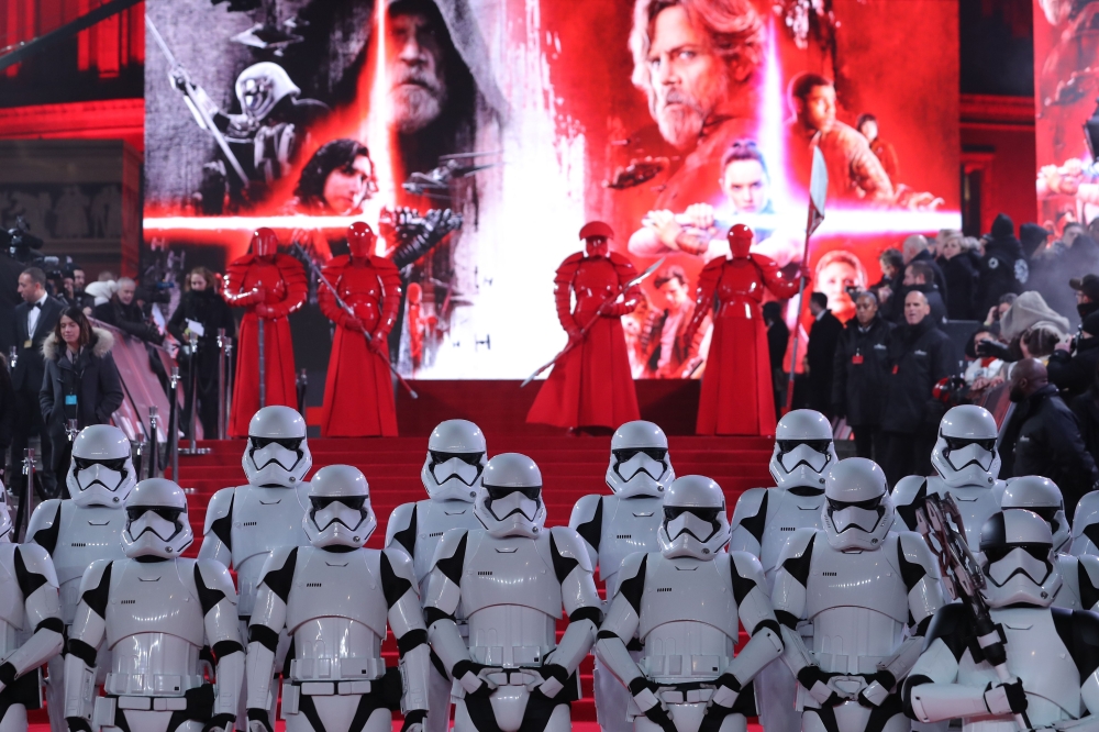 This Dec. 12, 2017 file photo shows Stormtrooopers and Praetorian guards posing on the red carpet for the European Premiere of 