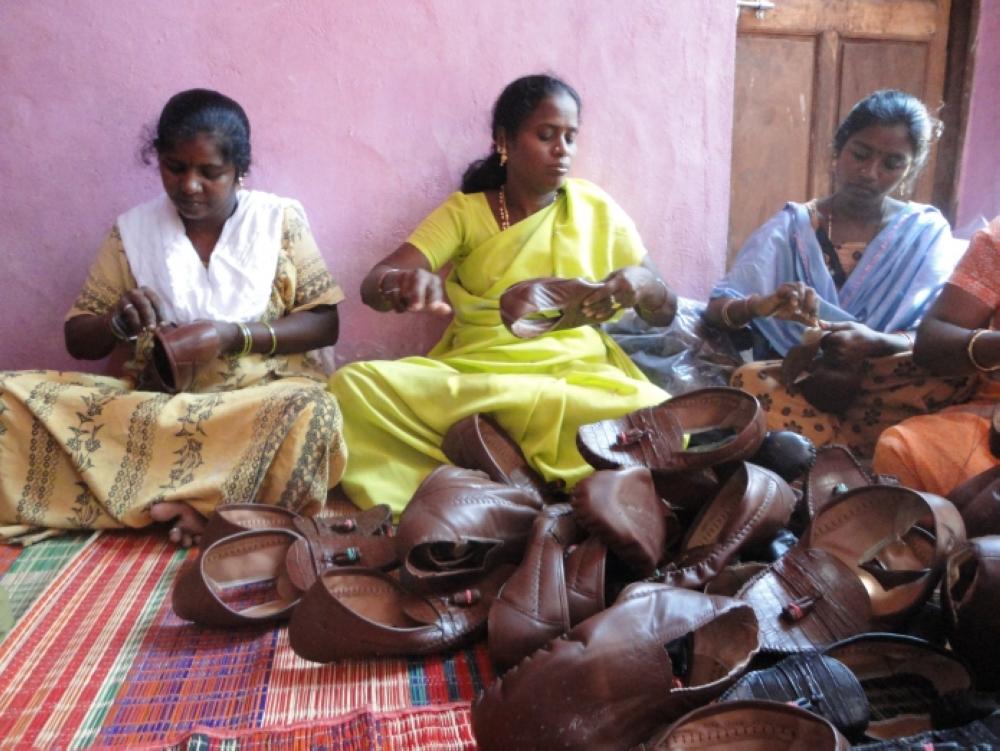 This undated file photo shows Indian women stitching shoes in Vellore, Tamil Nadu.