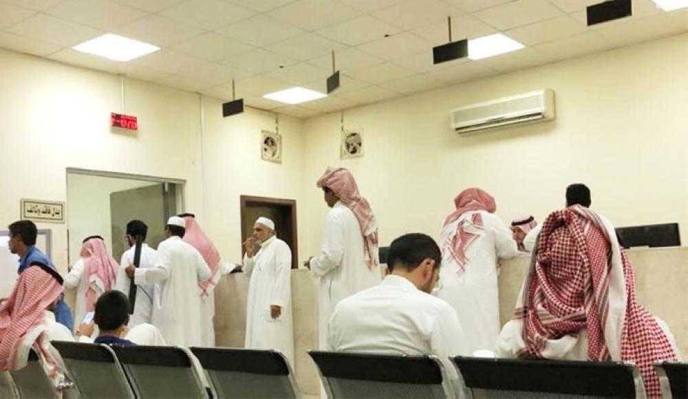 Real estate agents crowd a notary public office on Sunday in a rush to dispose of properties before the new tax laws took effect.