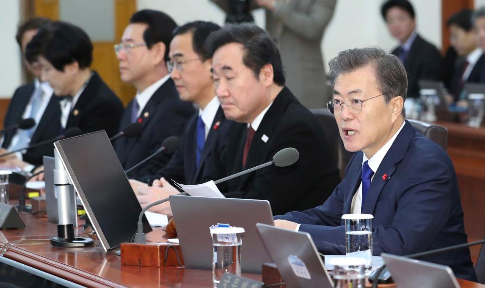 South Korean President Moon Jae-in, right, speaks during a cabinet meeting at the presidential Blue House in Seoul on Tuesday. — AP