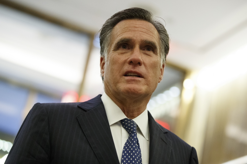 Mitt Romney talks with reporters after eating dinner with then President-elect Donald Trump at Jean-Georges restaurant in New York in this Nov. 29, 2016 file photo. — AP