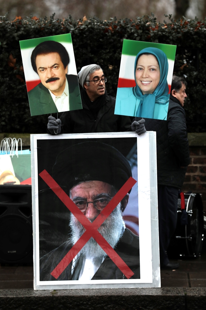 Opponents of Iranian President Hassan Rohani hold a protest outside the Iranian embassy in west London, Britain. — Reuters