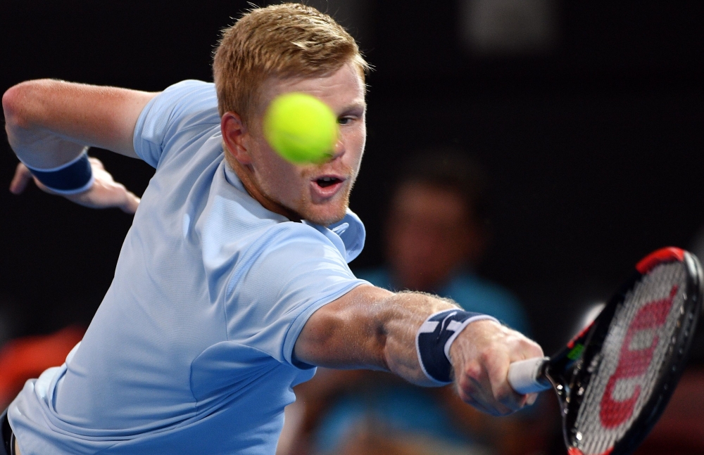 Kyle Edmund of Britain hits a return against South Korea's Chung Hyeon in their men's singles second round match at Pat Rafter Arena during the Brisbane International tennis tournament in Brisbane on Thursday. — AFP