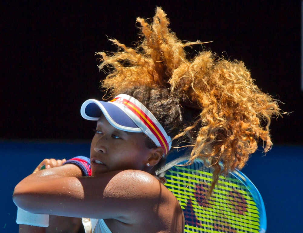 Naomi Osaka of Japan hits a return against Anastasia Pavlyuchenkova of Russia during their ninth session women's singles match on day six of the Hopman Cup tennis tournament in Perth on Thursday. — AFP