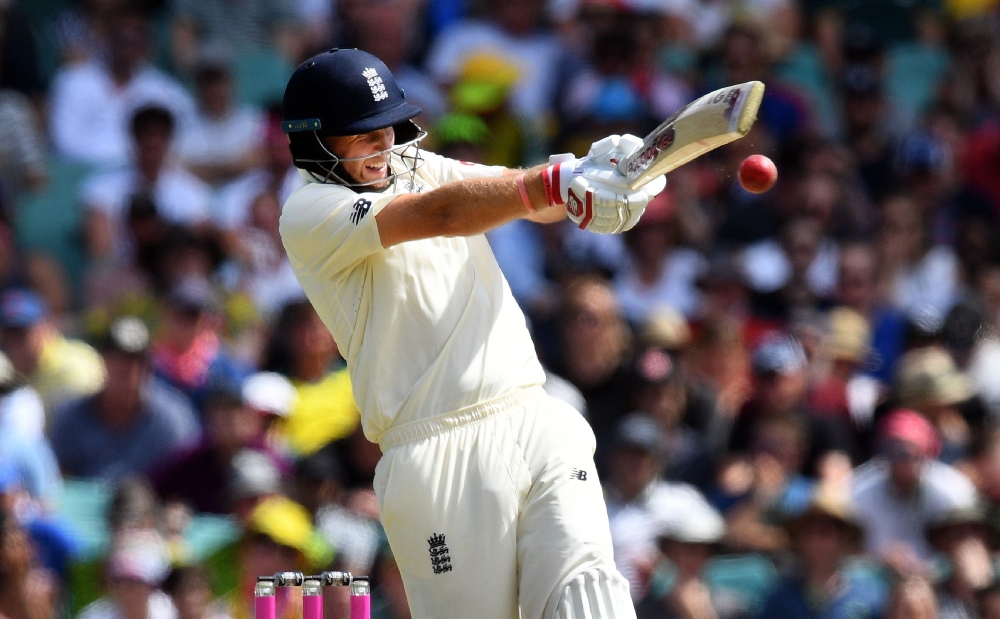 England batsman Joe Root pulls a ball away from Australia's attack on the first day of the fifth Ashes cricket Test match at the SCG in Sydney on Thursday. — AFP