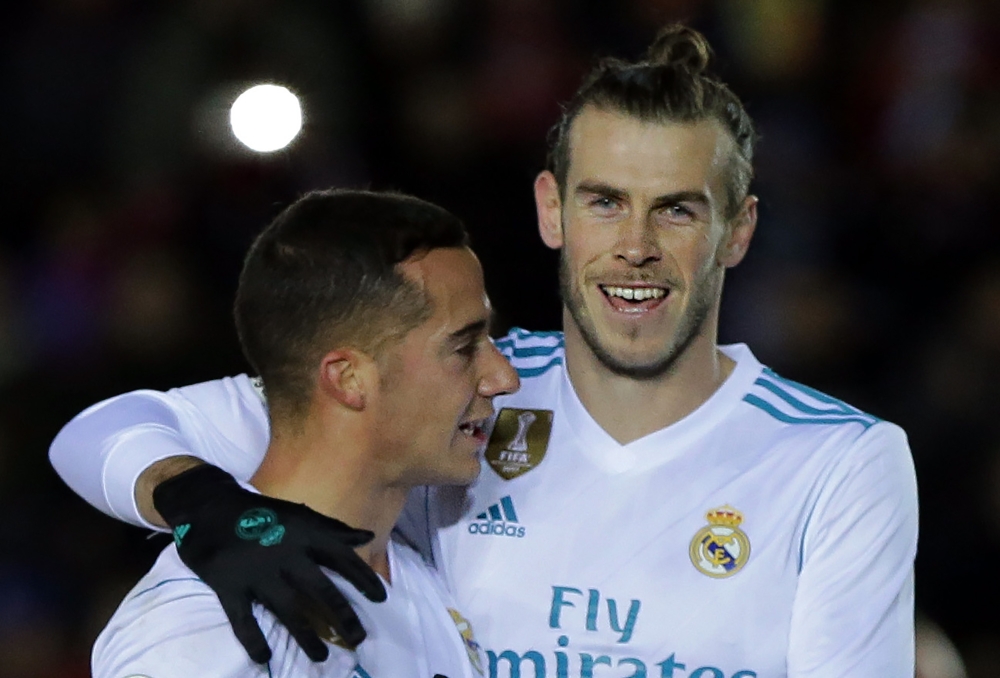 Real Madrid's Welsh forward Gareth Bale (R) celebrates with Real Madrid's Spanish midfielder Lucas Vazquez after scoring during the Spanish Copa del Rey (King's Cup) round of 16 first leg football match against Numancia at Nuevo Estadio Los Pajaritos stadium in Soria on Thursday, — AFP