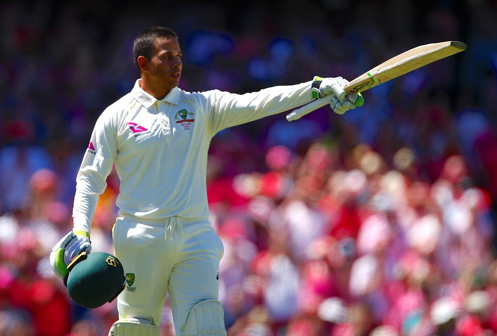 Australia’s Usman Khawaja celebrates after reaching his century during the third day of the fifth Ashes cricket Test match against England in Sydney Saturday. — Reuters