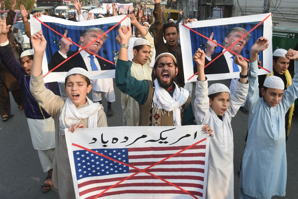 Pakistani demonstrators take part in a protest against US aid cuts in Lahore, Pakistan, on Friday. — AFP