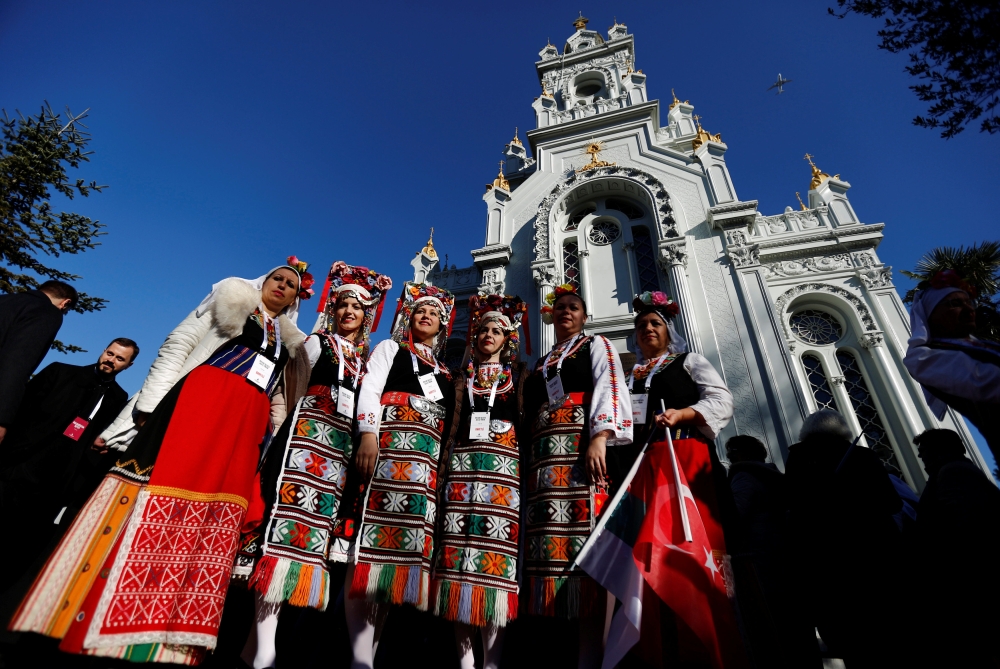 Bulgarian women in traditional costumes are seen during the re-opening of the St. Stefan Bulgarian Orthodox Church in Istanbul on Sunday. — Reuters