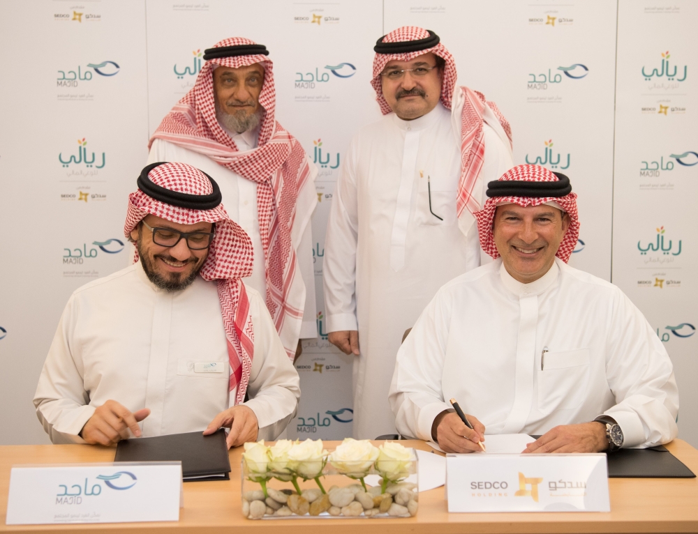 Officials of the SEDCO Holding Group and Majid Society during the signing ceremony. — Courtesy photo
