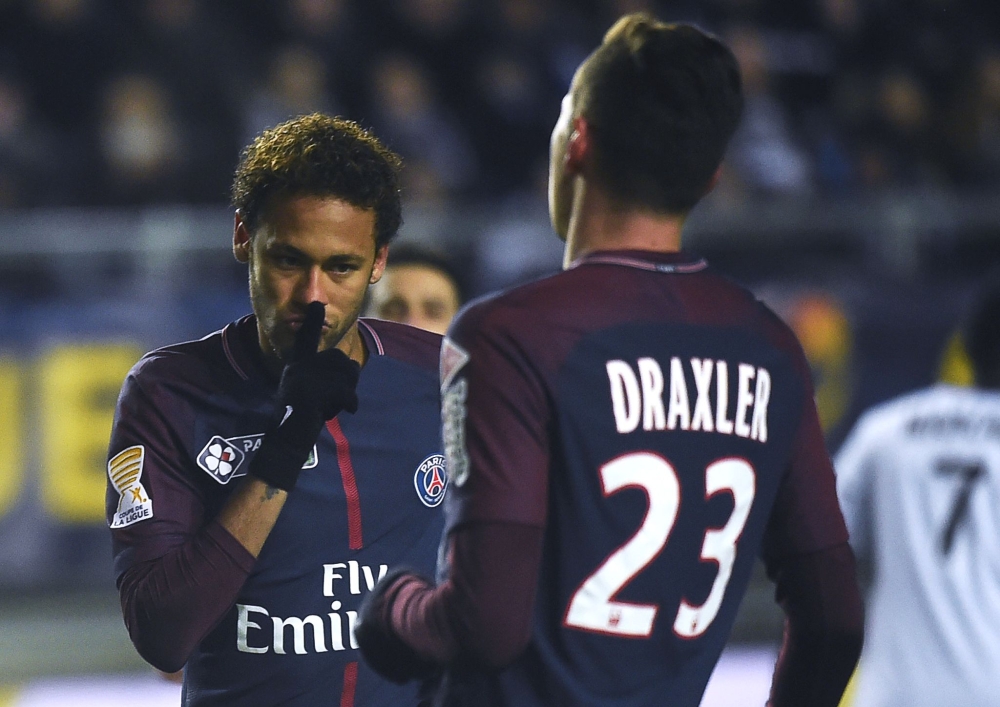Paris Saint-Germain's Brazilian forward Neymar (L) celebrates after scoring from a penalty kick during the French League Cup quarterfinal football match against Amiens (ASC) at the Licorne Stadium in Amiens, northern France, on Wednesday. — AFP